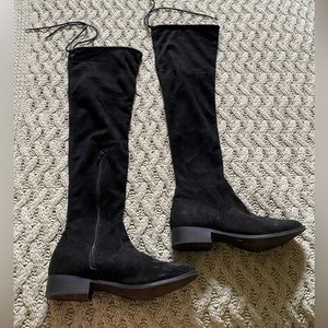 Black knee high boots. Light scuffing on toe of left boot